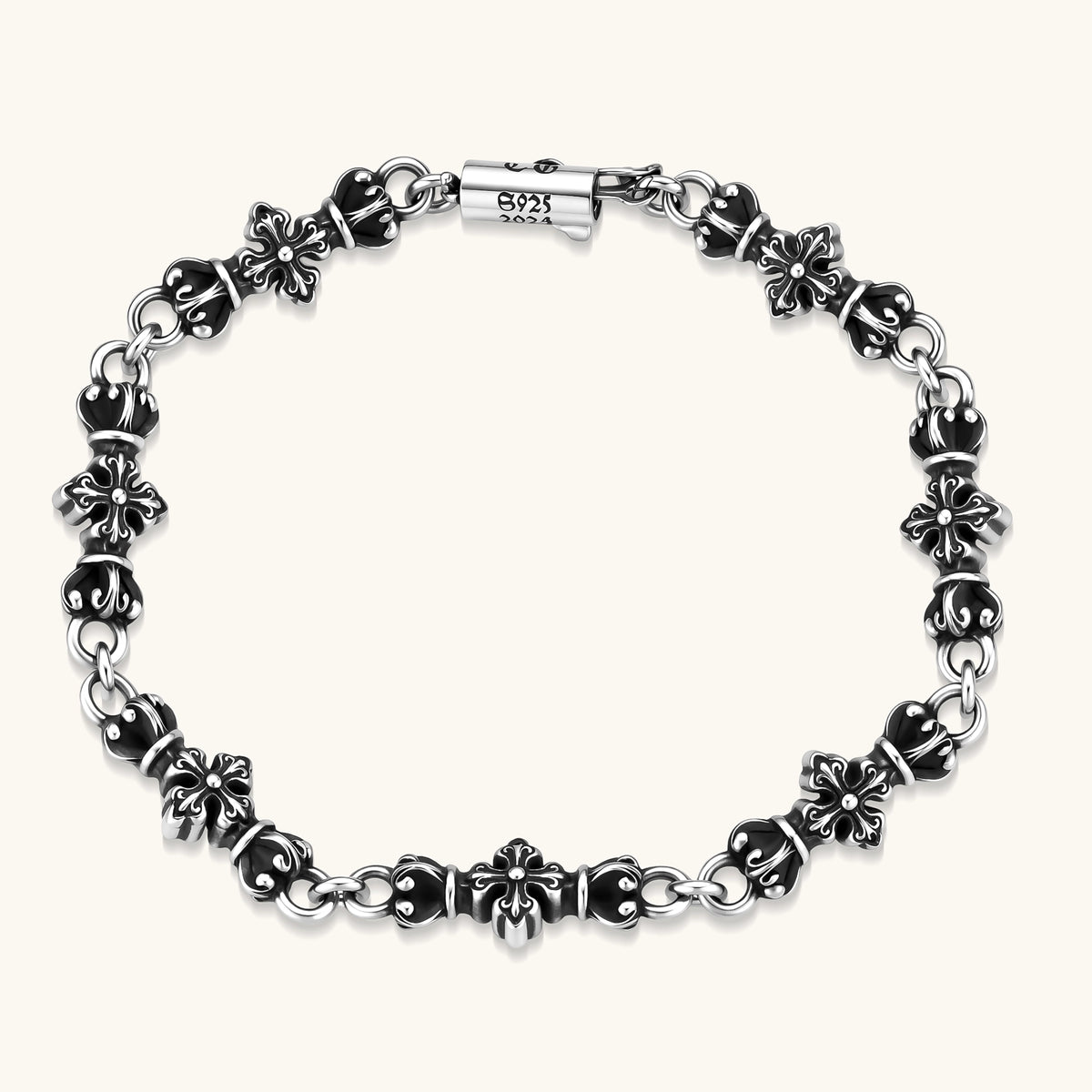 Oxidized 925 sterling silver bracelet with fleur-de-lis cross links, black-accented beads, and a cylindrical clasp stamped 2024.