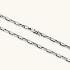 Polished 925 sterling silver paperclip link chain necklace, 3.7mm wide, with lobster clasp, on cream background.