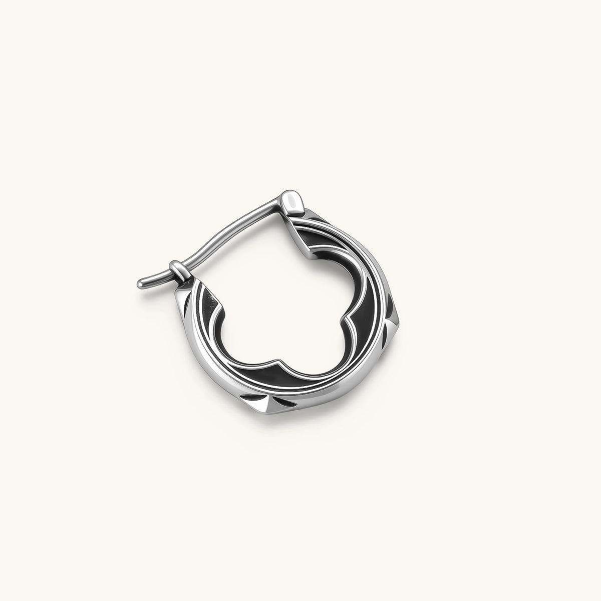 Polished 925 sterling silver quatrefoil hoop earrings with hinged snap closure and engraved hallmark, on cream background.
