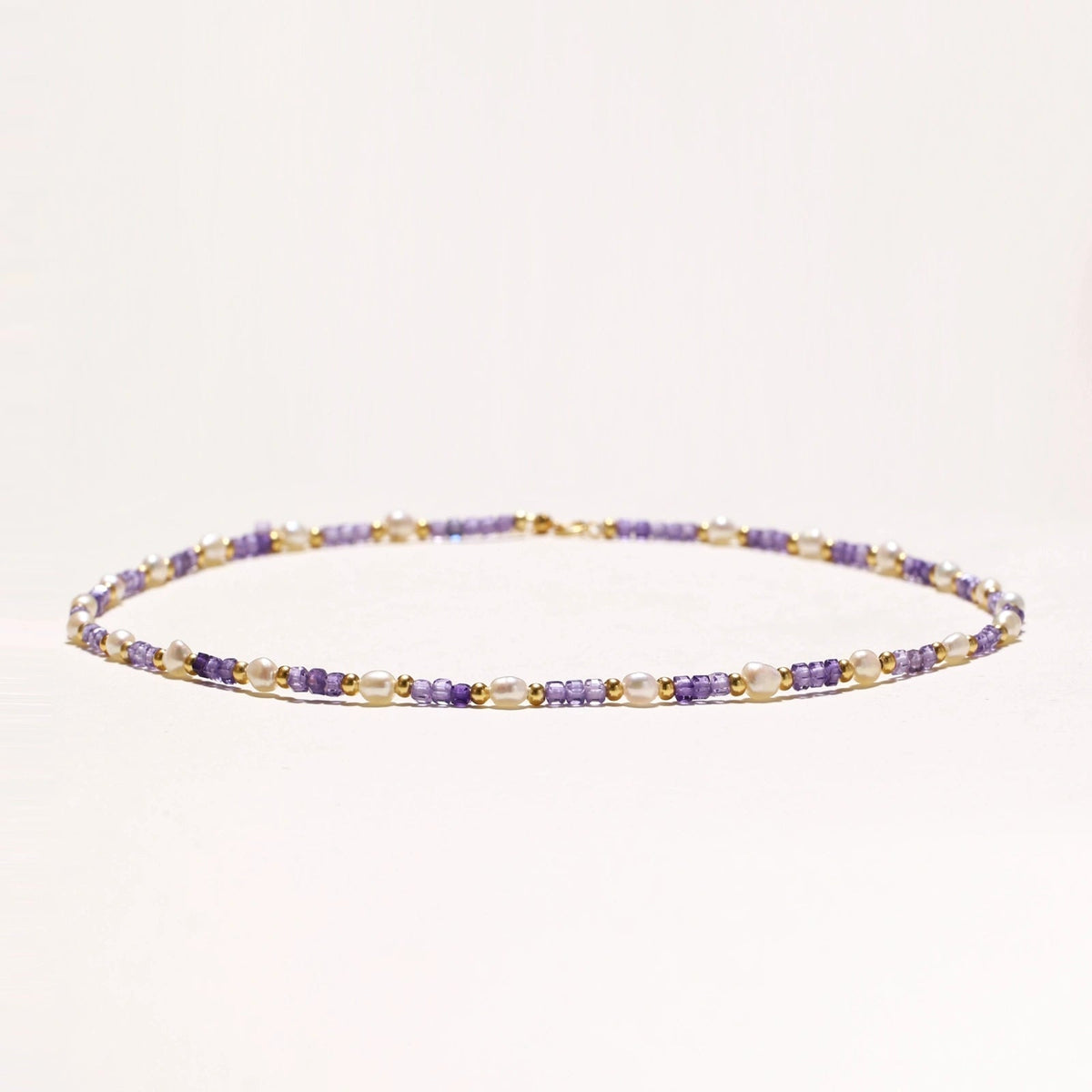 Anointed Garments Amethyst Pearl Harmony necklace featuring freshwater pearls, lavender zirconia, and 18K gold vermeil.