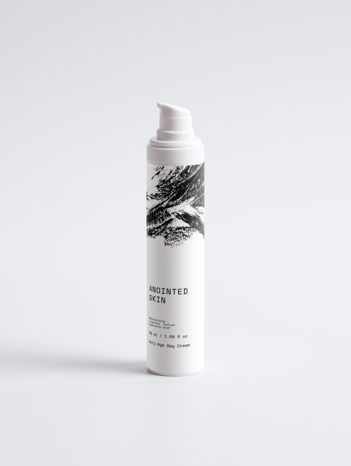 Anointed Garments Anointed Skin Anti-Age Day Cream in a white pump bottle with black brushstroke design.