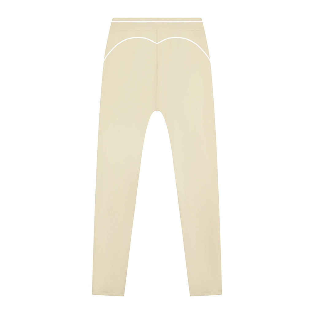 Anointed Garments high-waisted beige athletic leggings with white contrast piping detail for a modern sporty look.