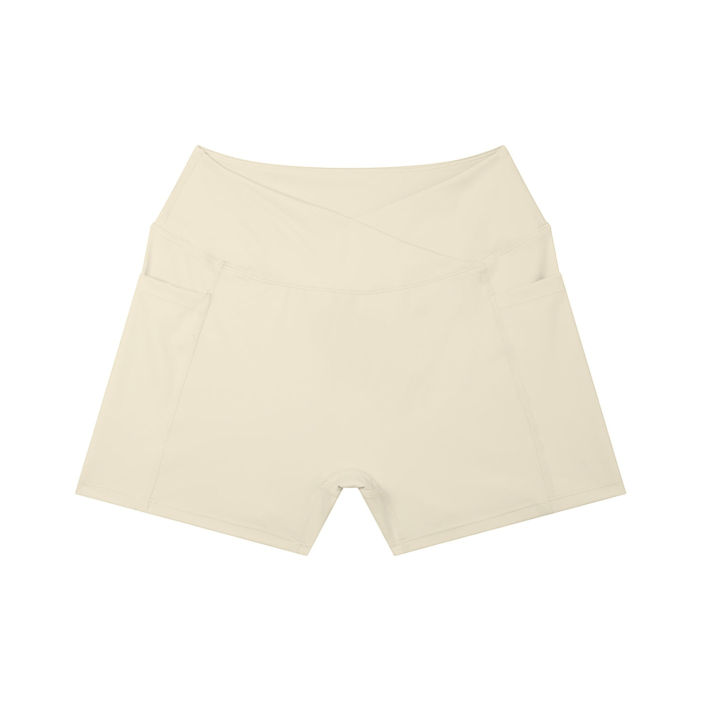 Anointed Garments beige high-waisted athletic performance shorts with a crossover waistband and side pockets.