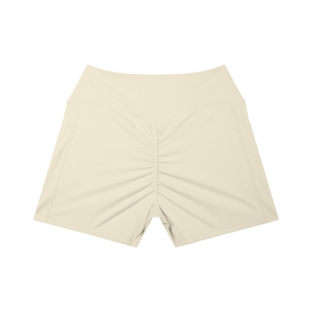 Anointed Garments beige high-waisted athletic shorts with a ruched back and side pockets for performance and comfort.