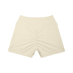 Anointed Garments beige high-waisted athletic shorts with a ruched back and side pockets for performance and comfort.