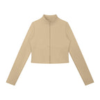 Anointed Garments beige long-sleeve full-zip sports jacket with a stand collar and fitted silhouette.
