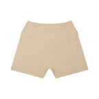 Anointed Garments beige high-rise yoga shorts with side pockets and a crossover waistband design.