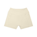 Anointed Garments beige high-rise yoga shorts with side pockets and a flattering crossover waistband design.