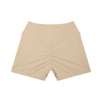 Anointed Garments beige high-waisted athletic shorts with a ruched back and side pockets for a sculpted performance fit.