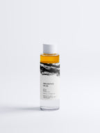 Anointed Garments Anointed Skin bi-phasic makeup remover in a clear bottle with a white cap on a white background.