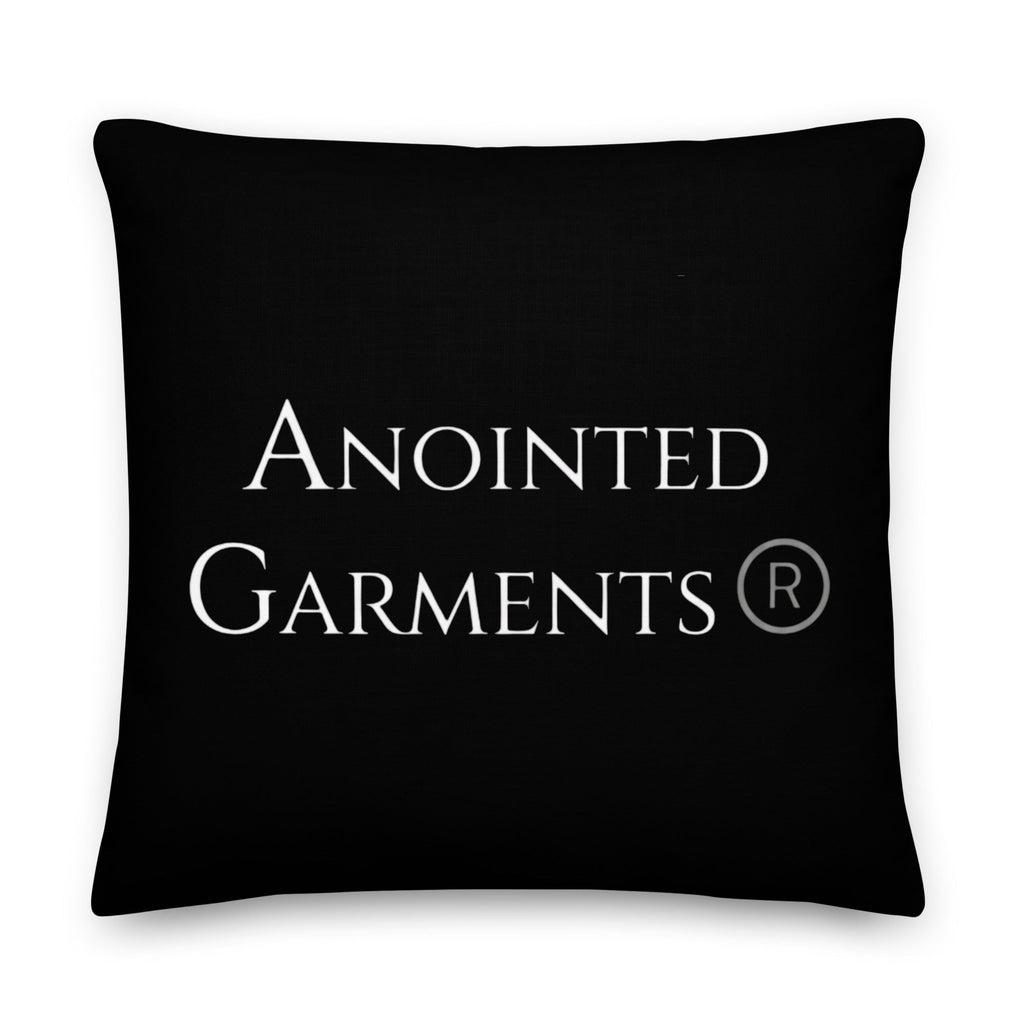 Anointed Garments premium black accent pillow with white brand logo and linen-feel textured polyester fabric.