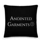 Anointed Garments premium black accent pillow with white brand logo and linen-feel textured polyester fabric.