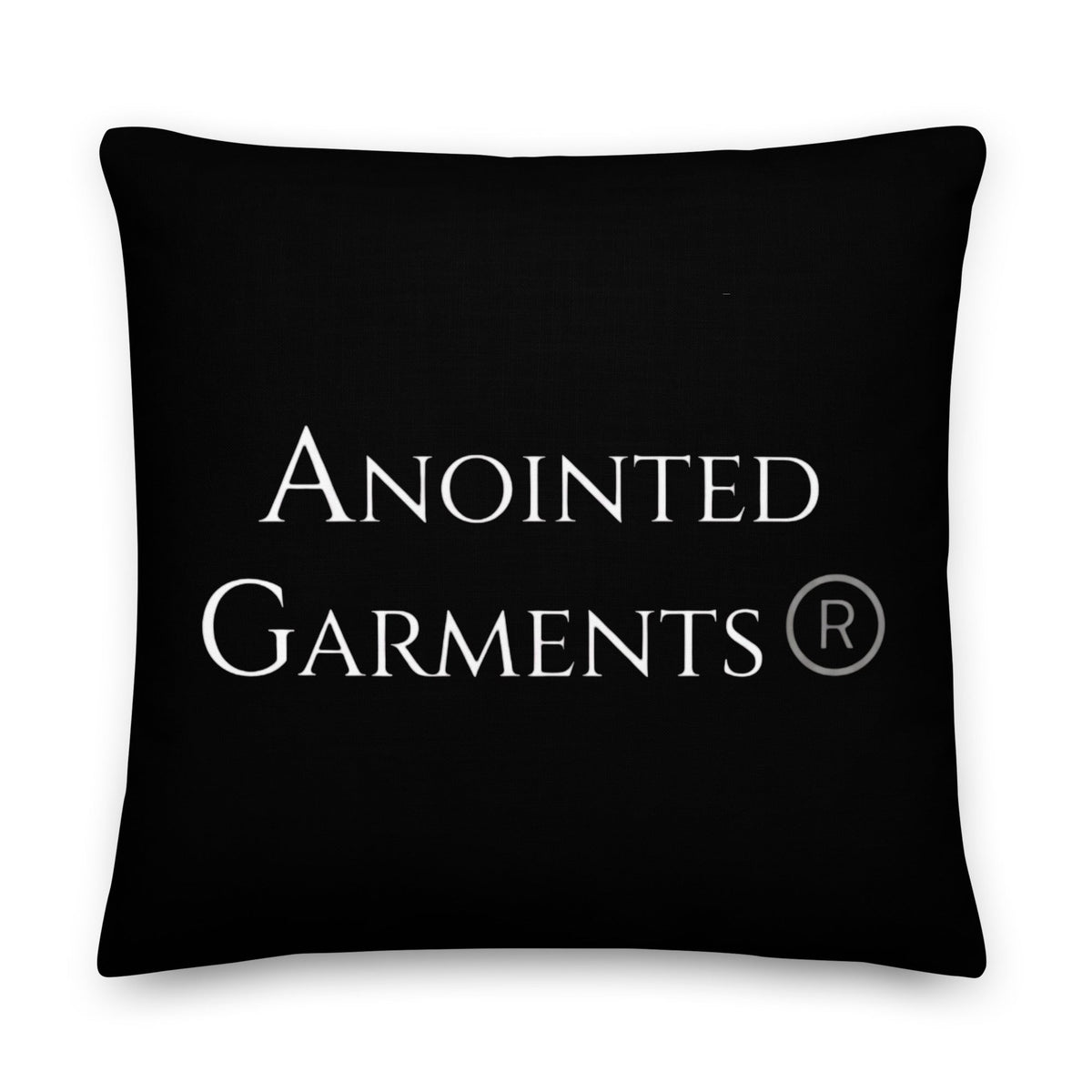 Anointed Garments premium black accent pillow with white brand logo and linen-feel textured polyester fabric.