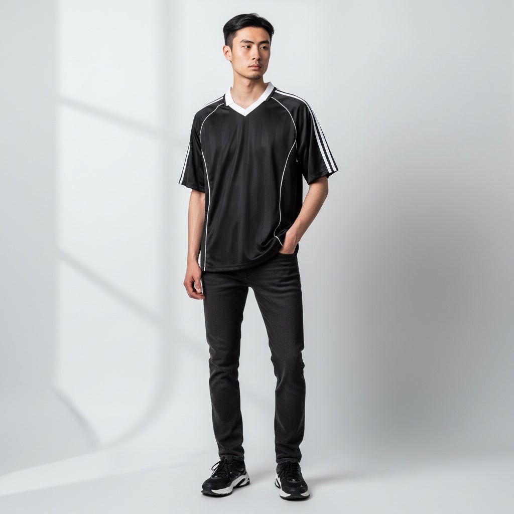Anointed Garments black athletic V-neck jersey with white contrast piping and shoulder stripes worn by a man.