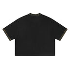 Back view of Anointed Garments black cotton crewneck t-shirt with camo print collar and sleeve cuff details.
