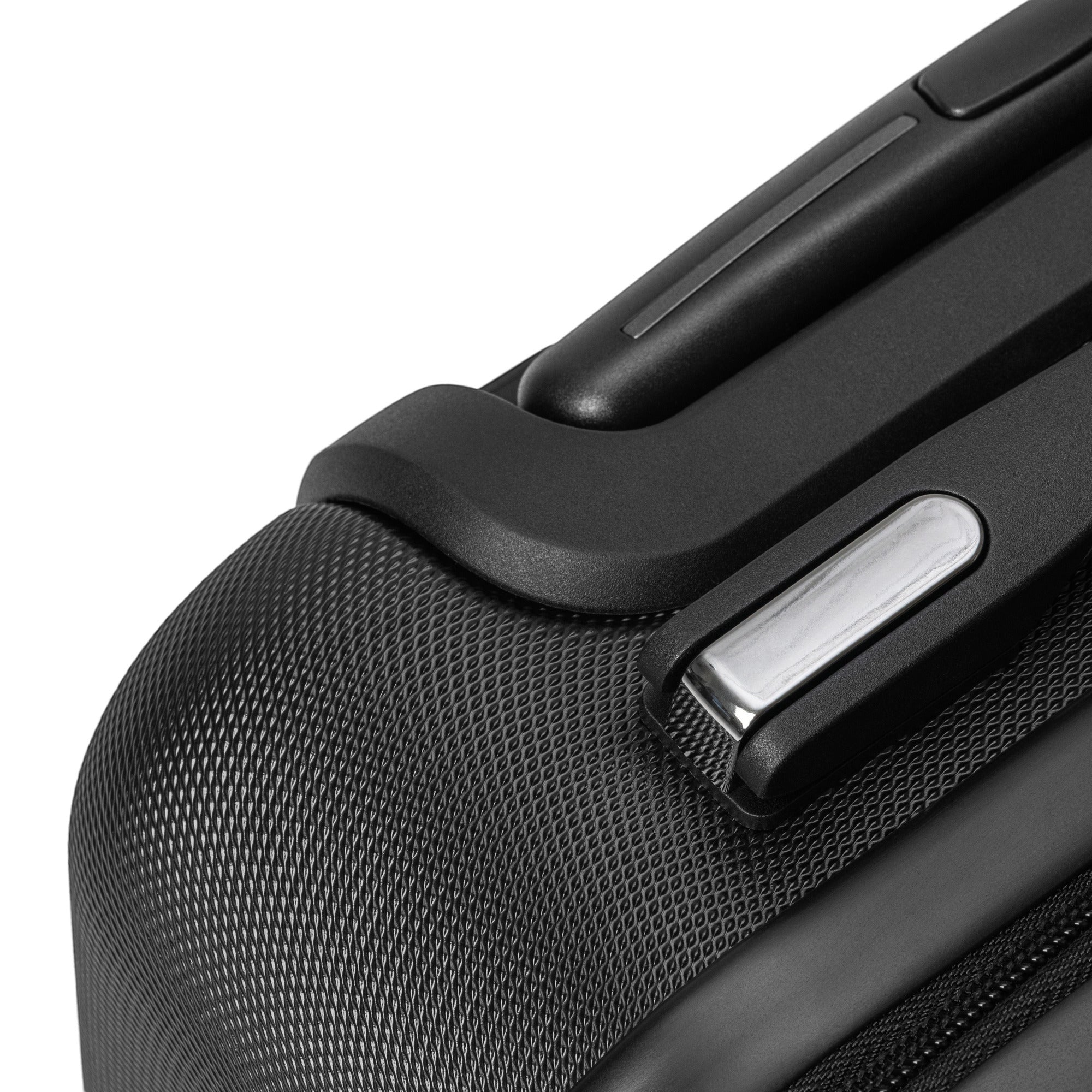 Anointed Garments black hardshell suitcase corner detail with textured finish and durable handle