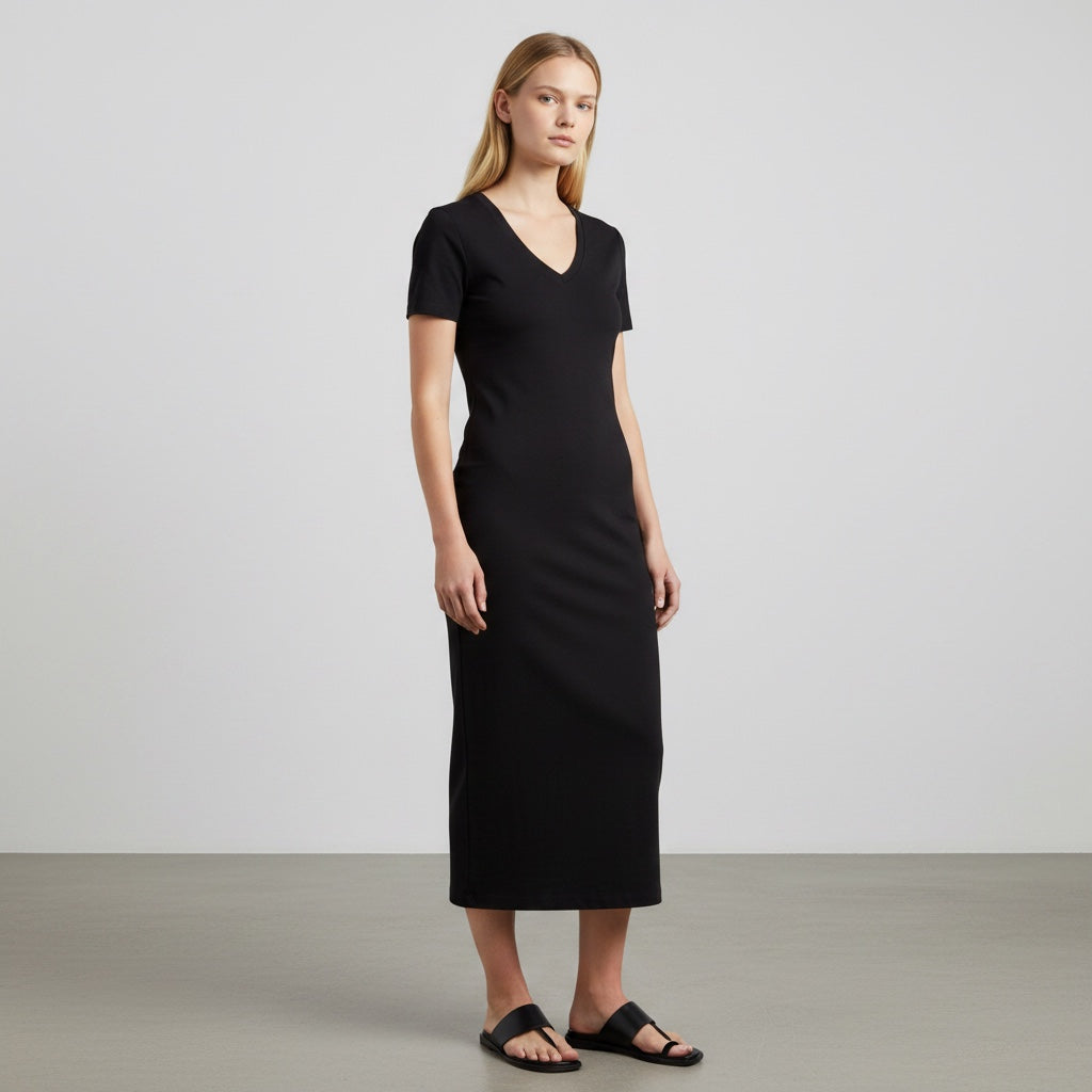 Anointed Garments black bodycon midi dress with V-neck and short sleeves worn by a model against a neutral background.