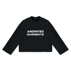Anointed Garments unisex black mock neck sweatshirt with a boxy fit, drop shoulders, and raw edge hem.