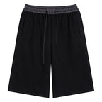 Anointed Garments unisex black casual shorts with a plaid elastic waistband, drawstring, and side pockets.