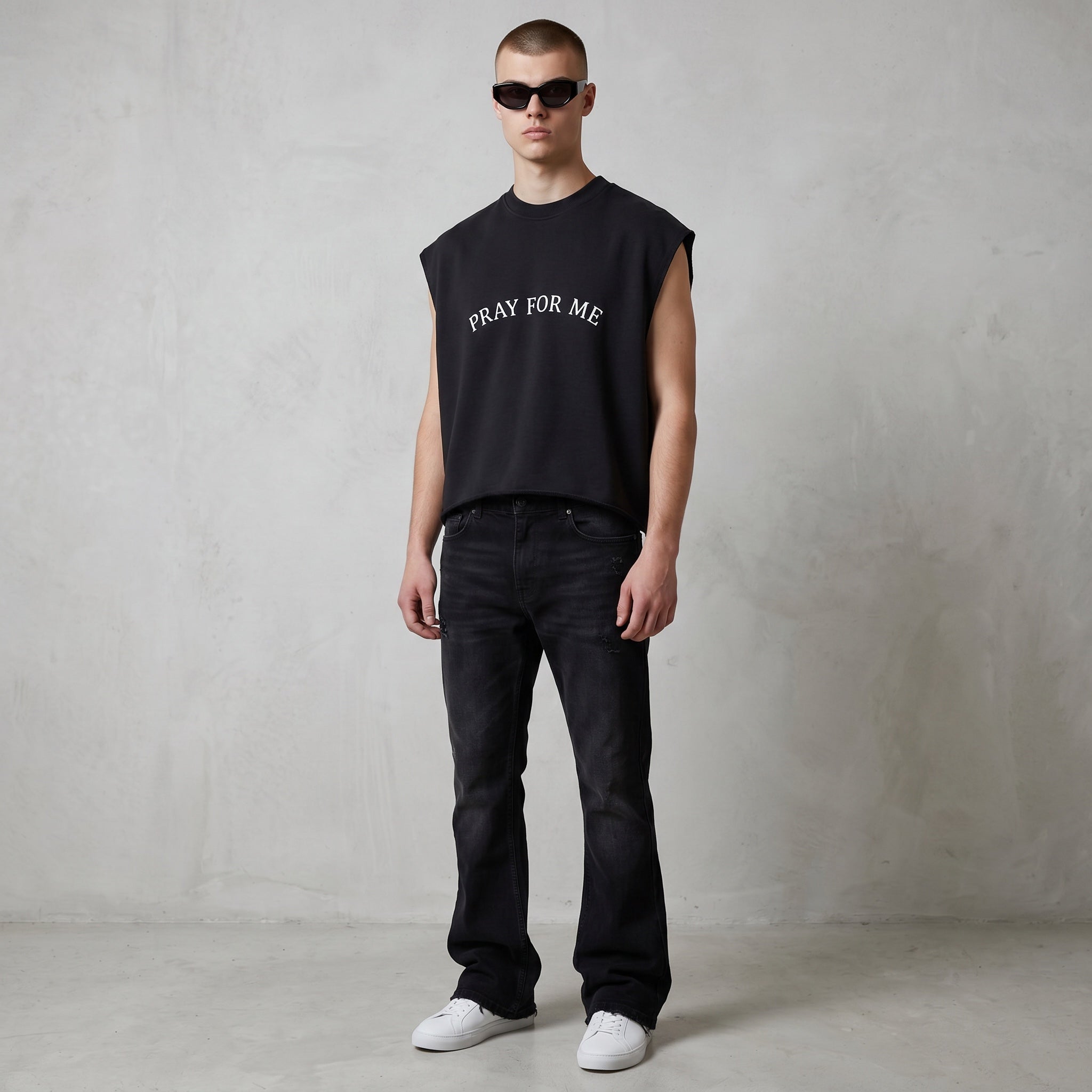 Anointed Garments black sleeveless crop top with Pray For Me text, worn by a model with sunglasses and black jeans.
