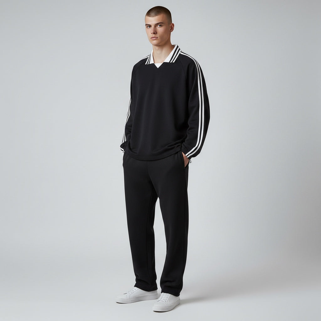 Model wearing Anointed Garments black cotton pullover sweatshirt with striped polo collar and sleeve side stripes.