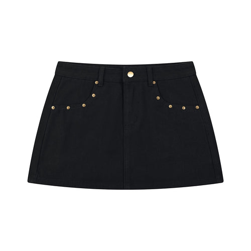 Anointed Garments black denim mini skirt featuring gold stud accents and a mid-waist fit.