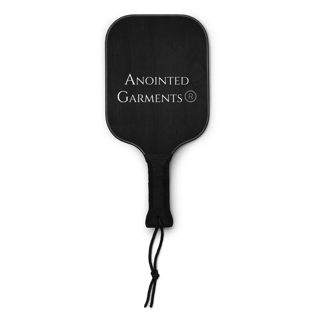 Anointed Garments pickleball paddle in black wood with a comfortable poly-cotton grip and branded logo