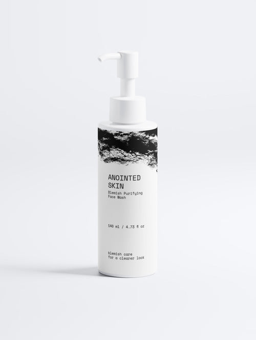 Anointed Garments ANOINTED SKIN Blemish Purifying Face Wash in a white pump bottle with black abstract label design.