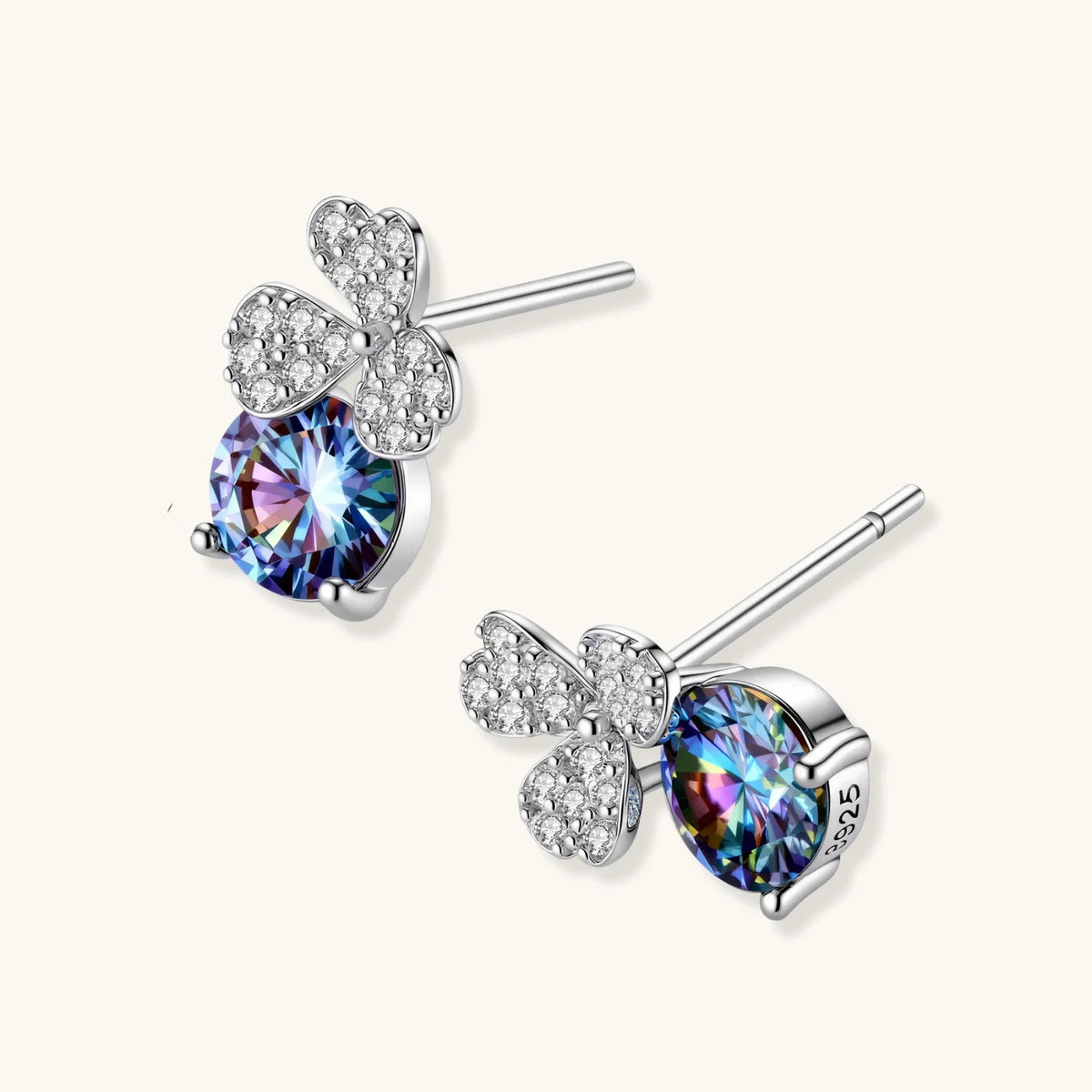 Anointed Garments blue clover moissanite stud earrings in platinum-plated 925 sterling silver with pavé accents.