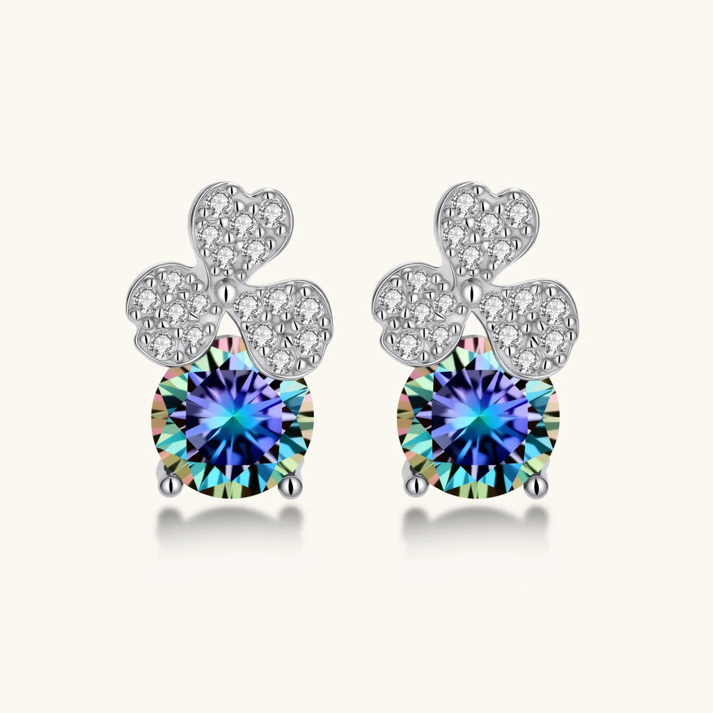 Anointed Garments blue clover moissanite stud earrings in platinum-plated sterling silver with round brilliant stones.