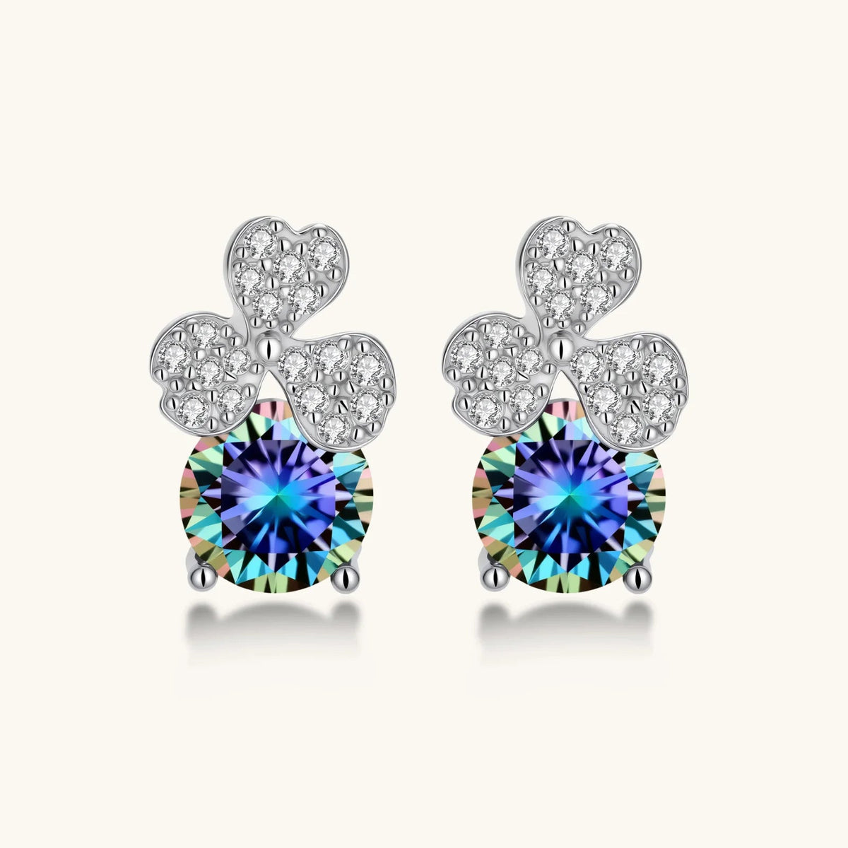 Anointed Garments blue clover moissanite stud earrings in platinum-plated sterling silver with round brilliant stones.