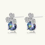 Anointed Garments blue clover moissanite stud earrings in platinum-plated sterling silver with round iridescent stones.
