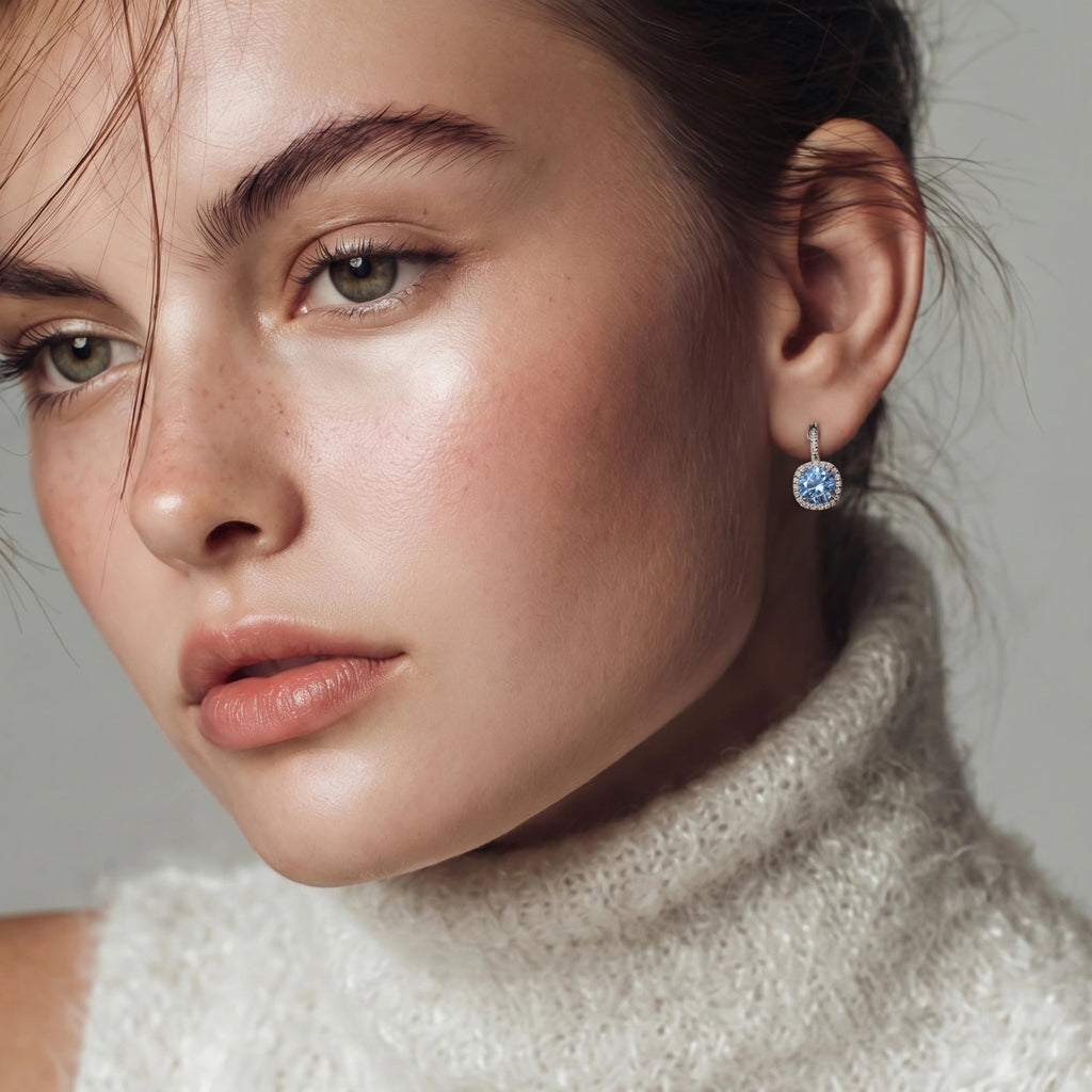 Anointed Garments Celestial Halo Drops featuring blue moissanite in a platinum-plated sterling silver cushion setting.