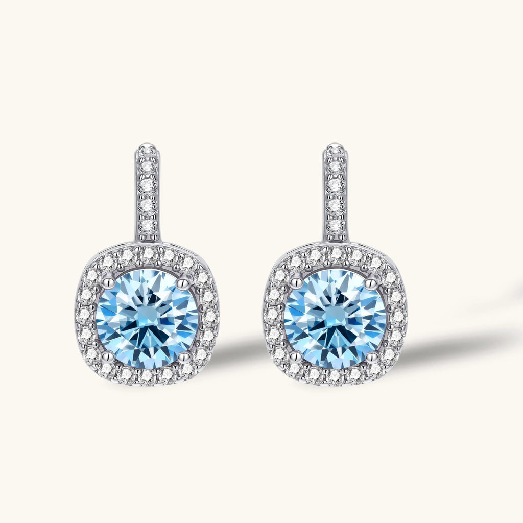 Anointed Garments Celestial Halo drop earrings featuring round blue moissanite stones in platinum-plated silver.