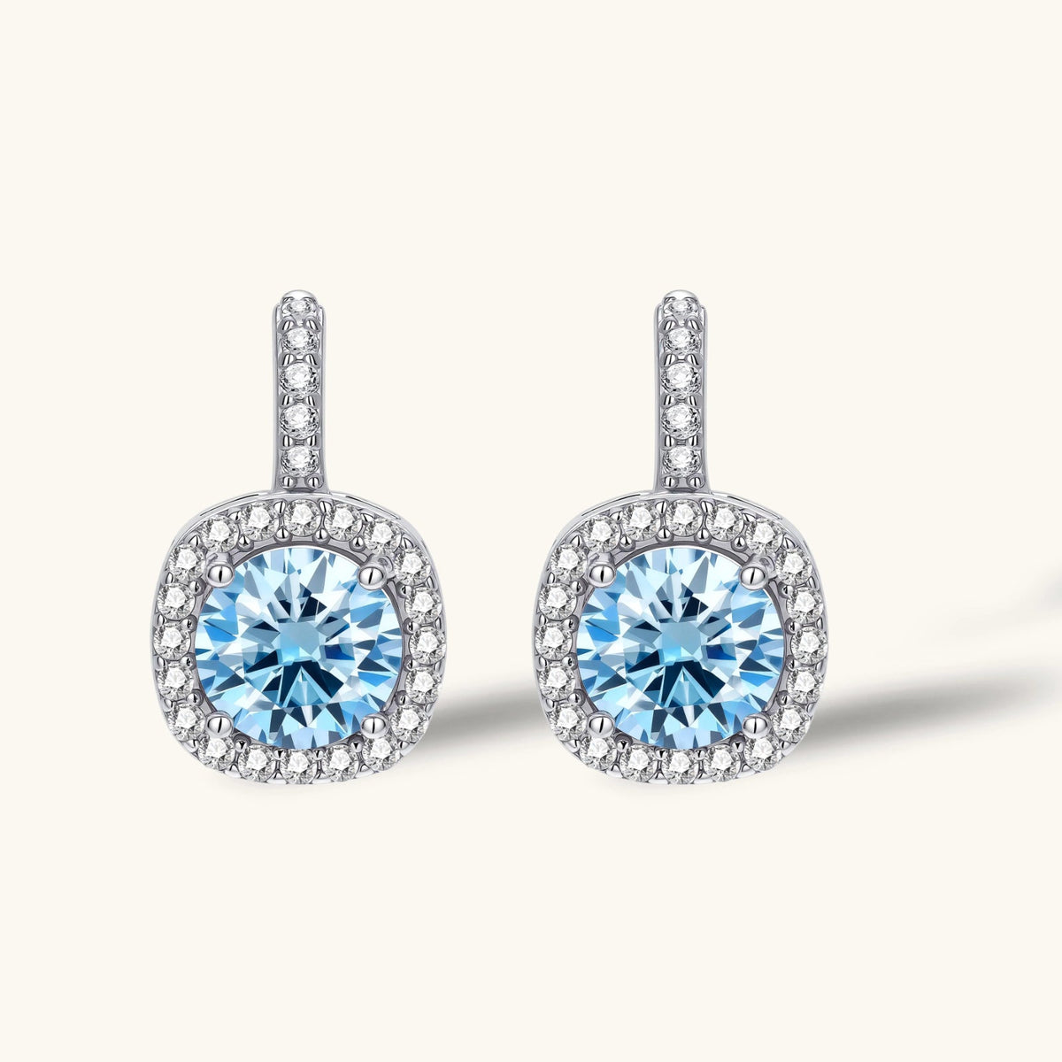Anointed Garments Celestial Halo drop earrings featuring round blue moissanite stones in platinum-plated silver.