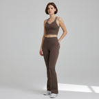 Anointed Garments brown racerback performance tank top with contrast piping worn by a model with matching leggings.