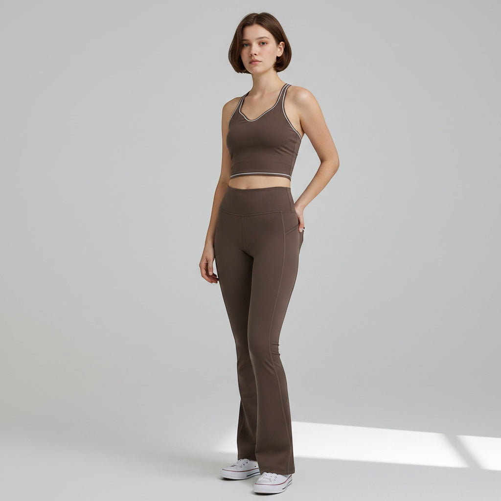 Anointed Garments brown racerback performance tank top with contrast piping worn by a model with matching leggings.