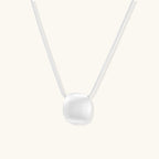 Anointed Garments brushed sterling silver disc pendant necklace on an adjustable chain with a soft matte finish.