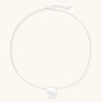 Anointed Garments brushed sterling silver disc pendant necklace on a delicate adjustable chain against a light background