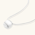 Anointed Garments brushed sterling silver disc pendant necklace on a delicate adjustable chain with a matte finish.