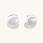 Anointed Garments brushed sterling silver stud earrings with a sculptural geometric silhouette and matte finish.