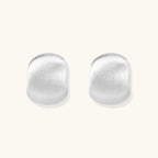 Anointed Garments brushed sterling silver stud earrings with a minimalist, sculptural geometric silhouette.