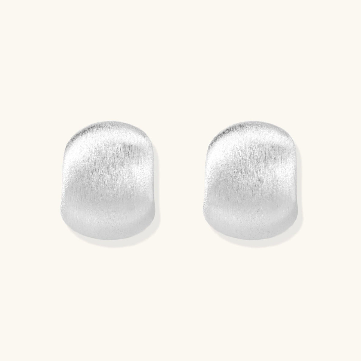 Anointed Garments brushed sterling silver stud earrings with a minimalist, sculptural geometric silhouette.