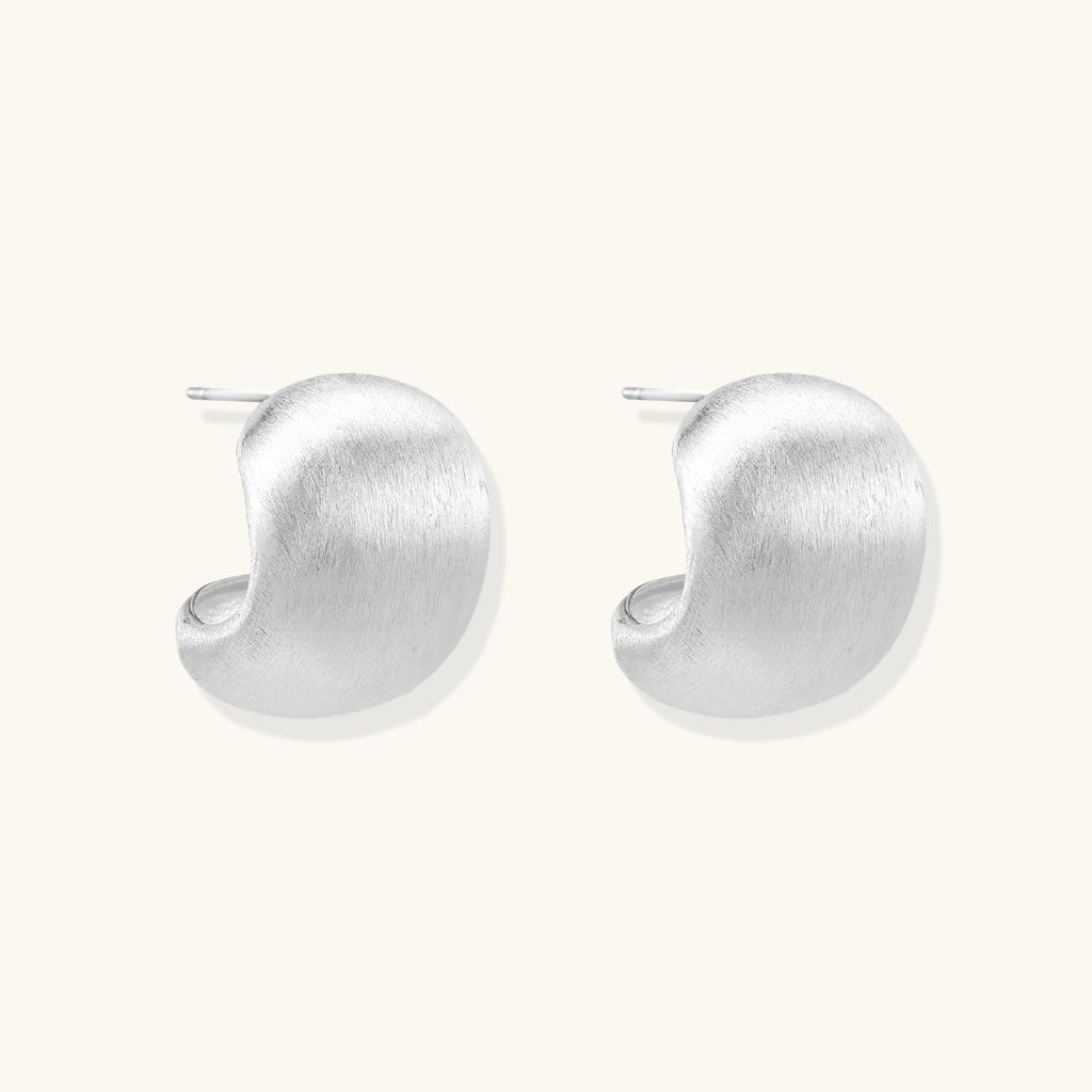 Anointed Garments brushed sterling silver geometric stud earrings with a soft, sculptural, and minimalist design.
