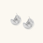 Anointed Garments brushed sterling silver stud earrings with a sculptural geometric silhouette and matte finish.