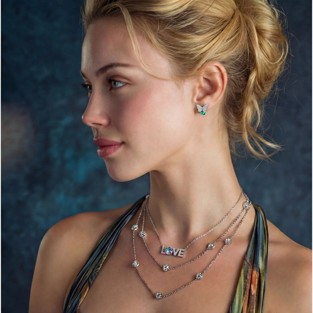 Anointed Garments Butterfly Transformation Studs in platinum-plated sterling silver with moissanite worn by a model