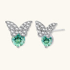 Anointed Garments butterfly stud earrings in platinum-plated sterling silver with green moissanite and clear accents.