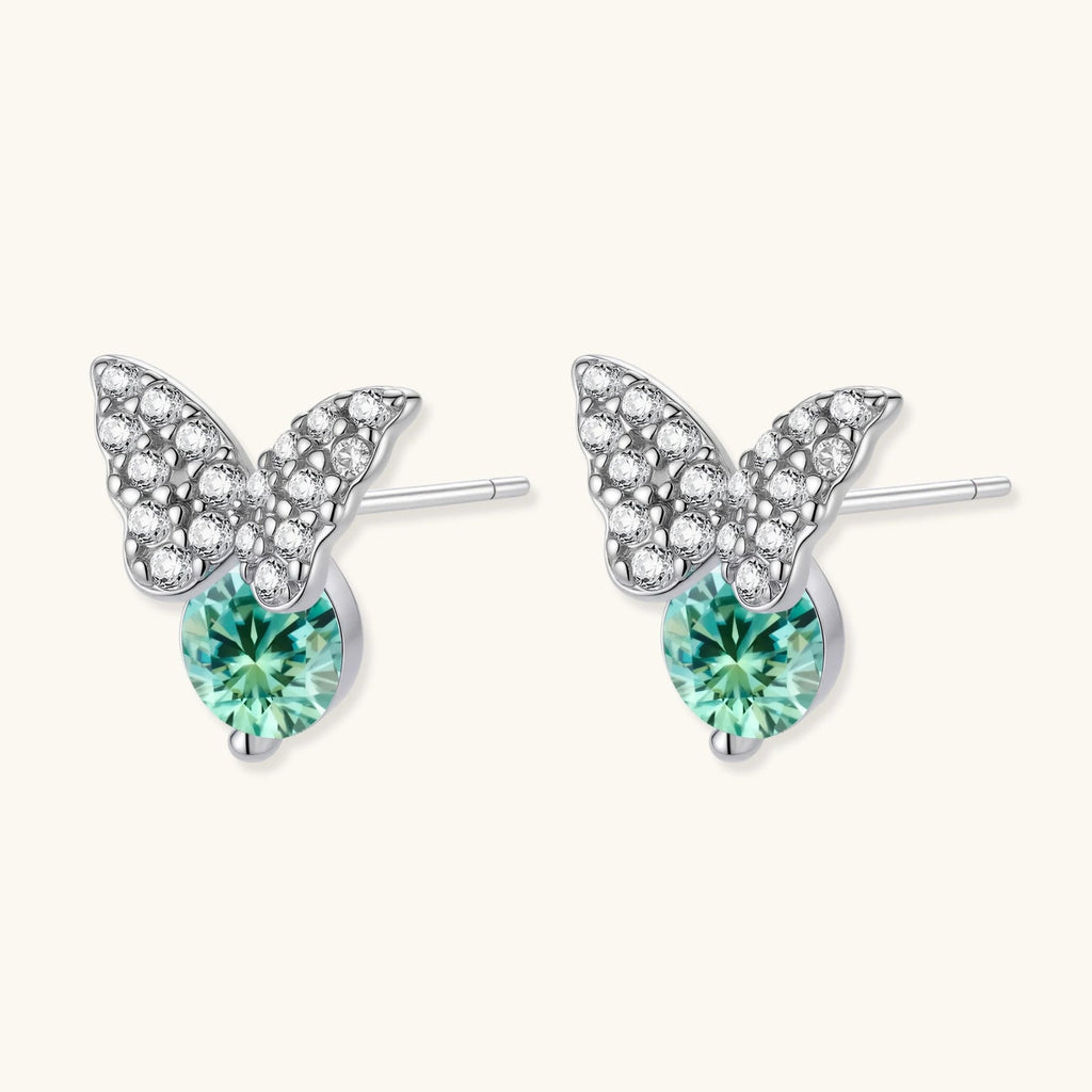 Anointed Garments butterfly stud earrings in platinum-plated sterling silver with green moissanite and clear accents.