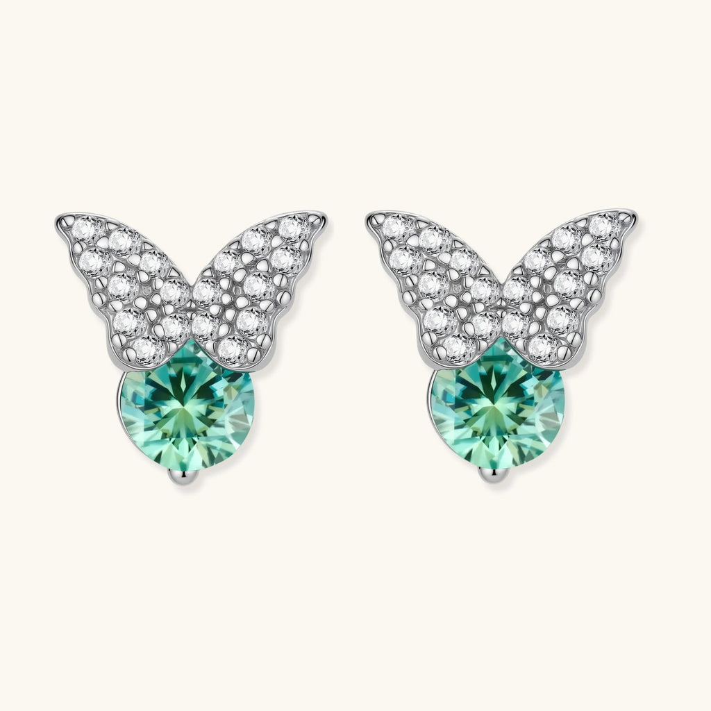 Anointed Garments butterfly stud earrings in platinum-plated sterling silver with round moissanite and green accents.