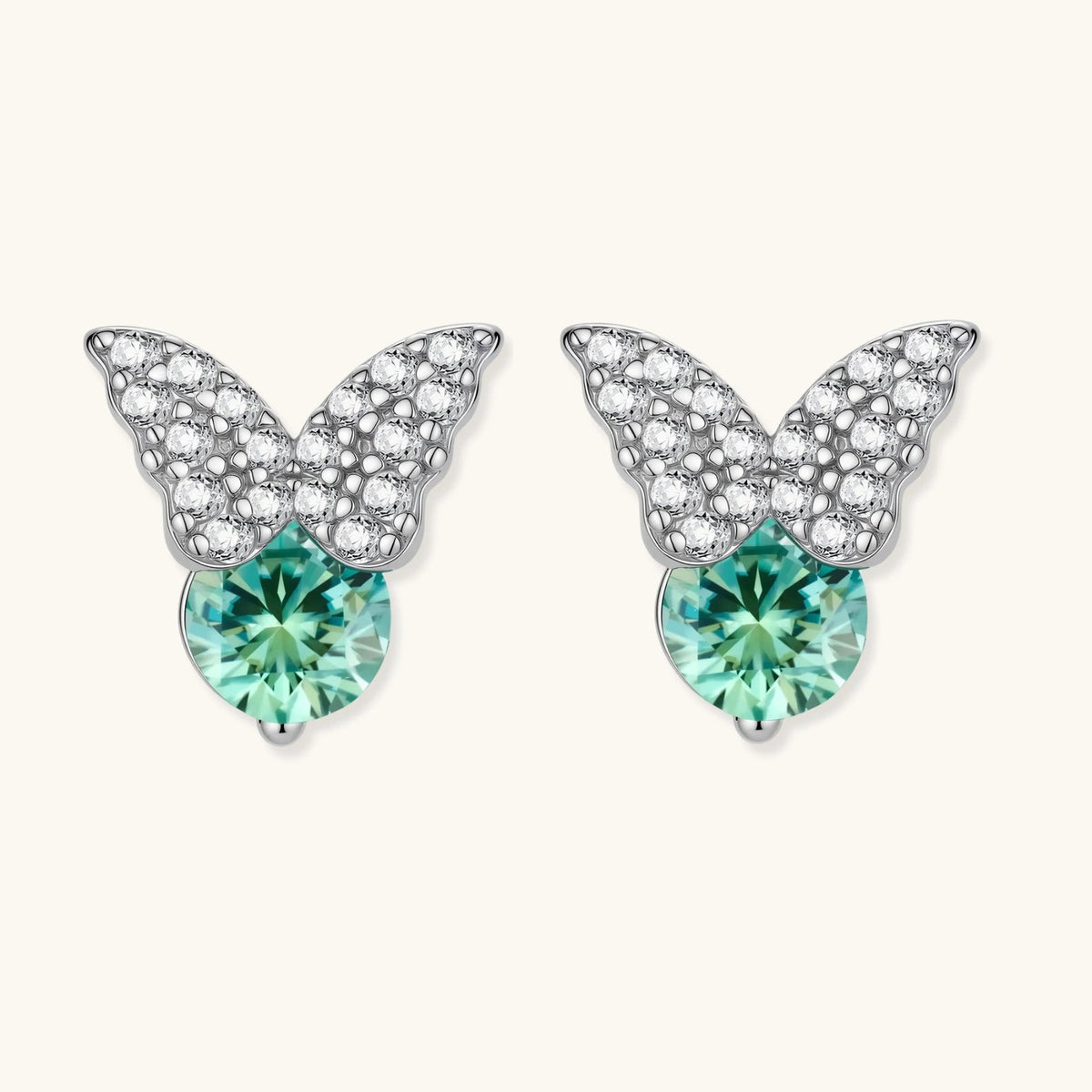 Anointed Garments butterfly stud earrings in platinum-plated sterling silver with round moissanite and green accents.